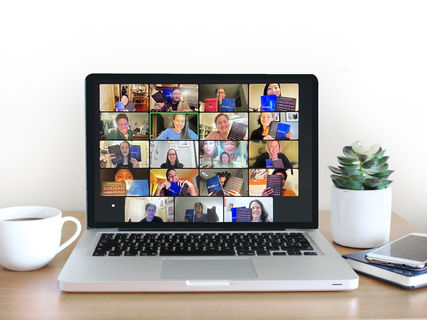 a laptop displaying 19 individuals holding up 2 books each and posing for a photo